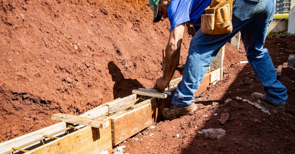 Male construction worker building a foundation outdoors in Londrina, Brazil.